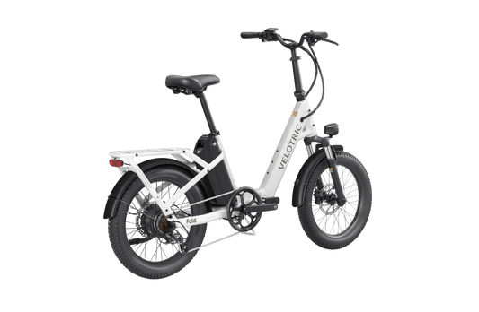A compact, black Velotric Fold 1 eBike shown folded, highlighting its portable design and sturdy frame.