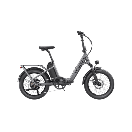 Velotric Fold 1 eBike in Stone Gray, folded for compact storage, side view on a plain background.