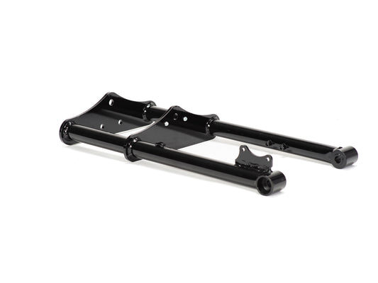 Close-up view of Stomp Ebox Dragster motorcycle forks, showing the suspension components and metallic finish.