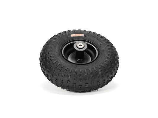Stomp Ebox Dragster rear wheel with mounted tire, side view, showing tread pattern and alloy rim design.