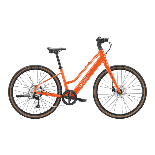 Velotric Tempo Mid Step eBike in Sunset Tangerine color, side view, against a plain background.