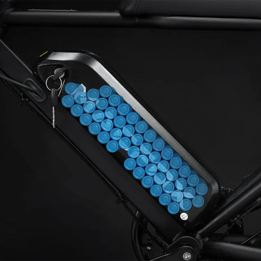 Side view of the Macfox M16 eBike in a studio setting, showcasing its rugged frame, fat tires, and modern design features.