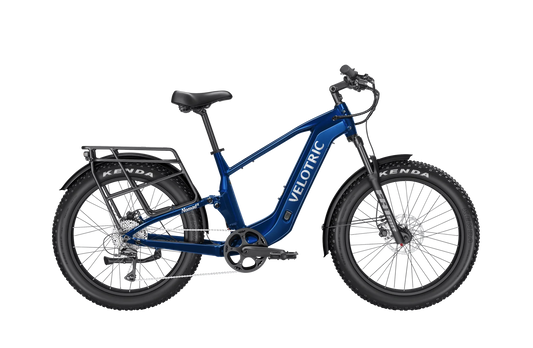 Royal blue Velotric Nomad 2X eBike in high step frame style, side view, isolated on white background