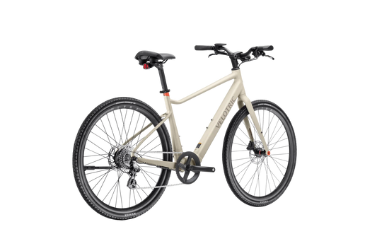 A sleek Velotric T1 ST Plus eBike in a modern setting, showcasing its lightweight frame, integrated battery, and minimalist design.