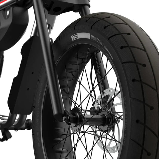 Side view of the Super73 ZX Core Legacy Series eBike in metallic aluminum, showcasing its frame, wheels, and battery design against a plain background.