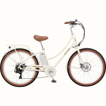 Retrospec Beaumont Rev 3 electric bike in eggshell color, side view, featuring step-through frame, rear rack, and brown saddle and grips.