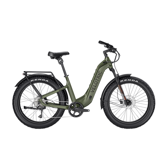 Olive green Velotric Nomad 2 electric bike side view with fat tires and rear rack