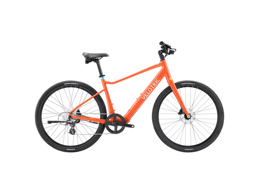Velotric T1 ST Plus eBike in Lava color, side view, showcasing sleek frame design and integrated battery