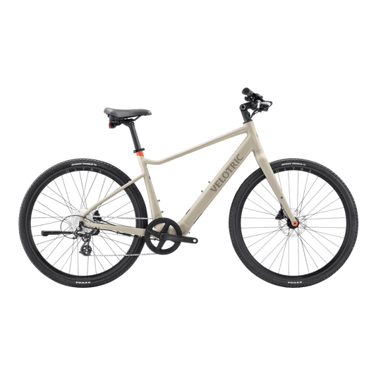 Velotric T1 ST Plus electric bike in sand color, side view, isolated on a white background
