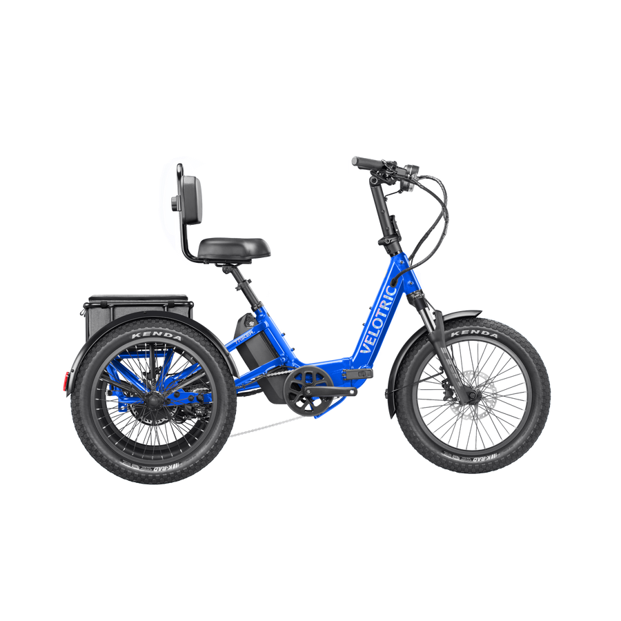 Electric blue Velotric Triker eTrike, side view, showing three wheels and modern frame design