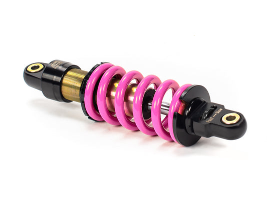 Stomp Ebox DNM 270mm rear shock absorber, side view showing coil spring and mounting hardware against a white background.