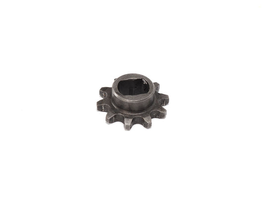 Front view of a Stomp Ebox motorcycle front sprocket, showing metal teeth and central mounting holes against a plain background.