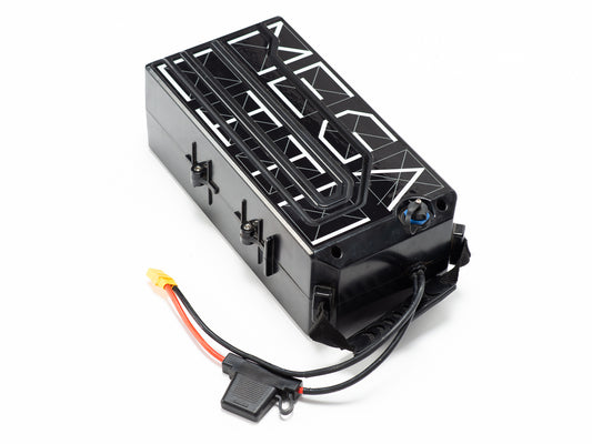 Stomp Ebox Megalith 72V Battery & Charger Kit showing a rectangular black battery pack with a digital display, power cables, and a matching charger unit placed beside it.
