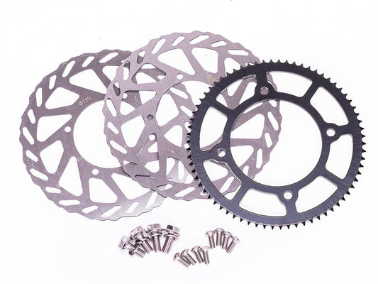 Stomp Ebox Supermoto Wheel Set 12-12, close-up view showing black alloy rims with silver spokes and knobby tires, displayed against a white background.