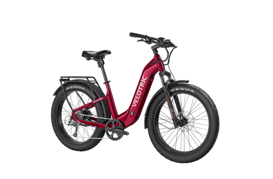 Velotric Nomad 2 electric bike in cranberry red, side view, against a white background
